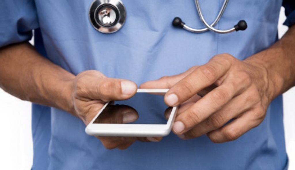 Doctor holding a cell phone